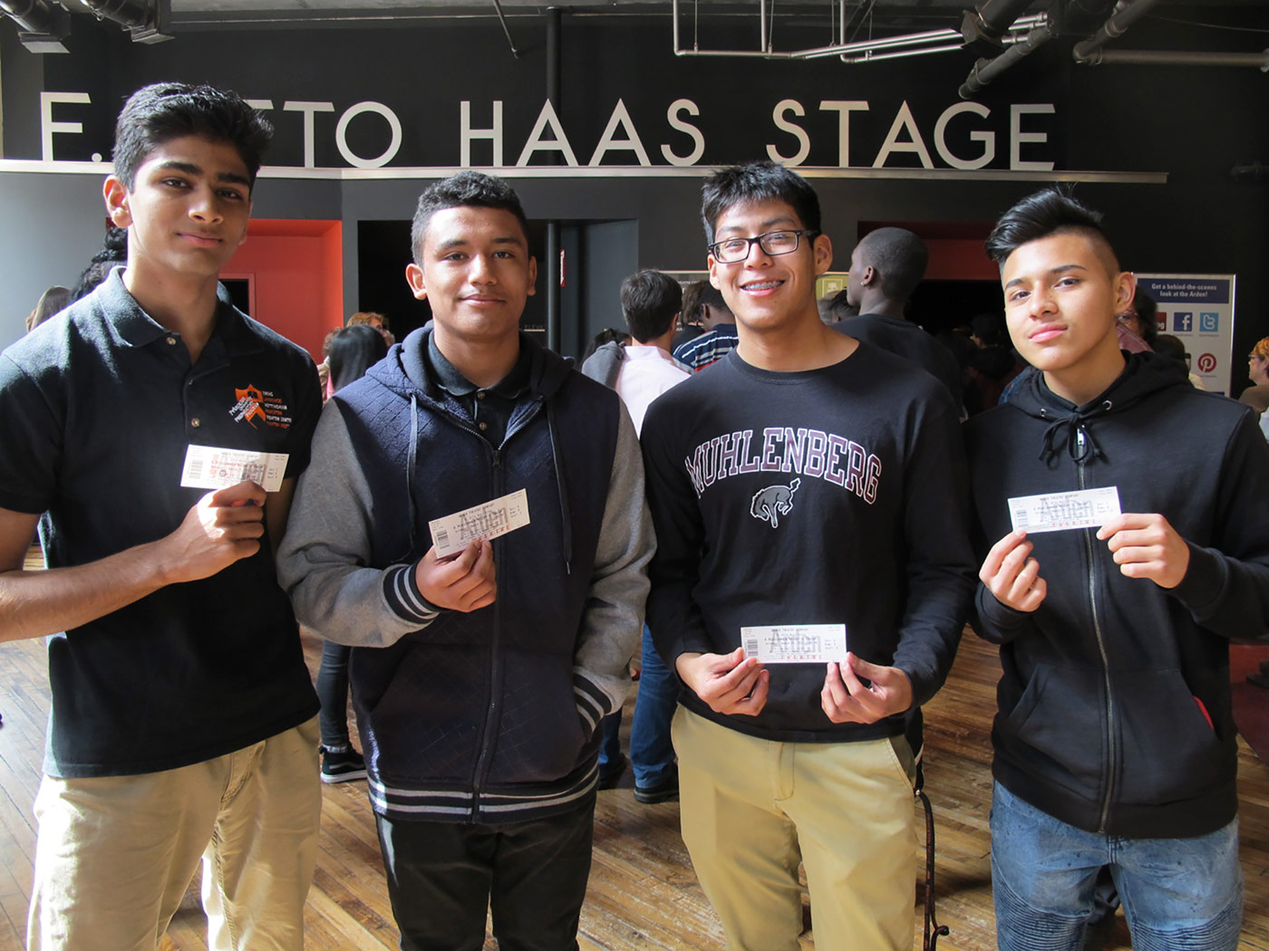 students holding theater tickets at the theater